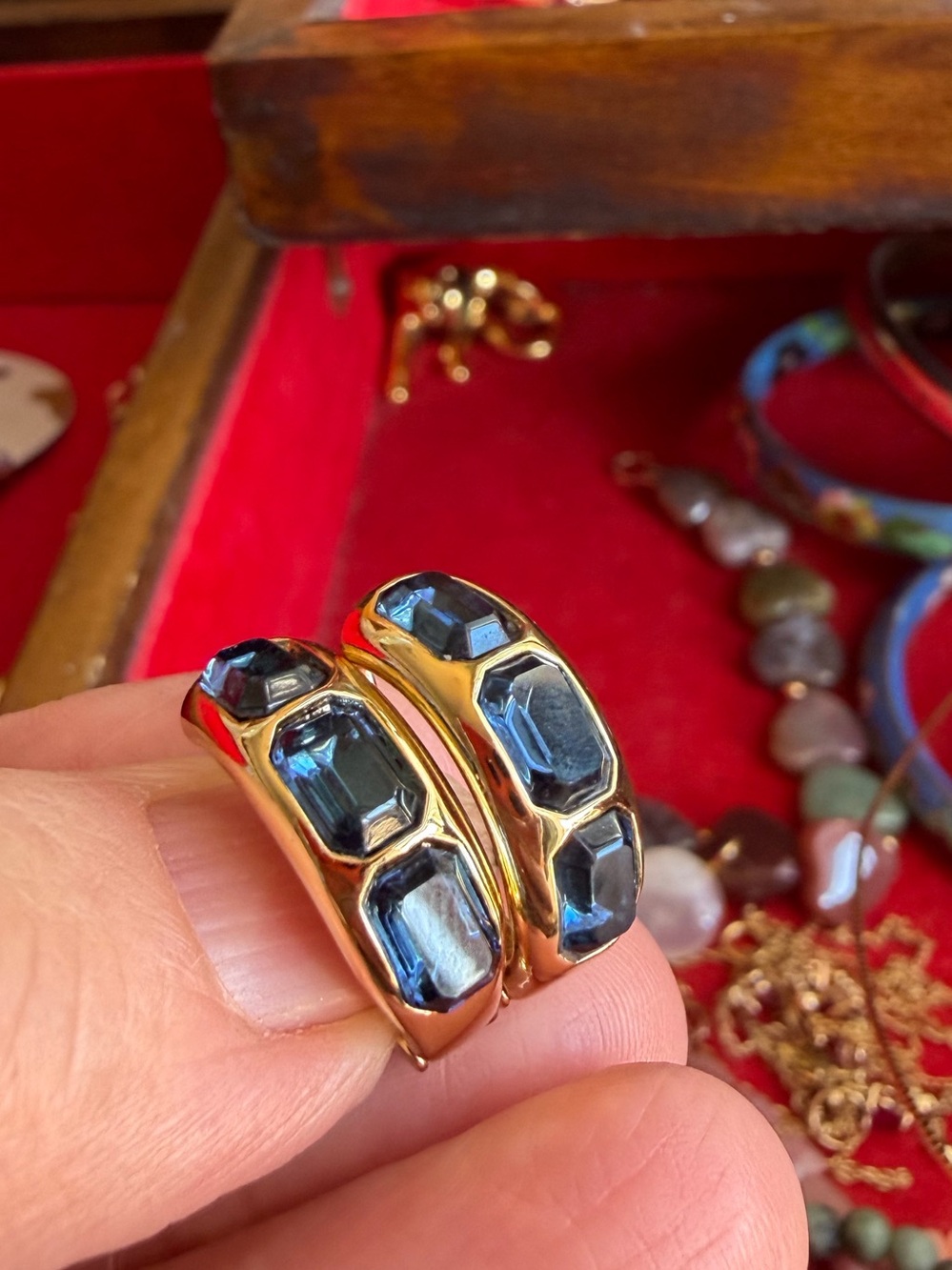 Gold Hoops with Blue Gem Accents.